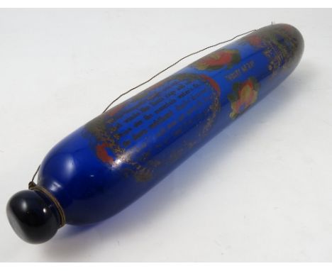 A 19th century Bristol blue glass rolling pin, with gilt and painted decoration of a verse, Forget Me Not and Royal coat of a