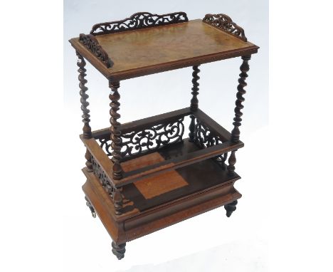 A 19th century walnut rectangular what not Canterbury, fitted with a shelf, with fret cut sides below, fitted with a drawer t