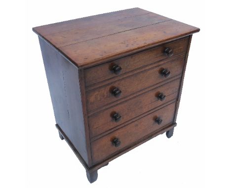 A late Georgian cupboard commode, the door formed as four dummy drawers, raised on stile feet, width 25ins 