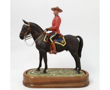 A Royal Worcester limited edition model, of Royal Canadian Mounted Policeman, modelled by Doris Lindner, with plinth and cert