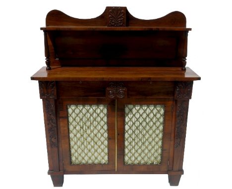 A 19th century rosewood chiffonier, with superstructure with shelf over, having two frieze drawers over brass grilled doors, 