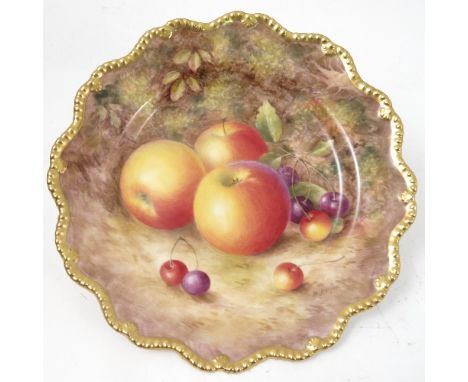 A Royal Worcester cabinet plate, decorated with hand painted fruit, by Ayrton, to a shaped gilded gadrooned border, circa 195