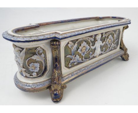 A Royal Worcester table trough, modelled with classical scenes and dolphin supports, width 15.5ins