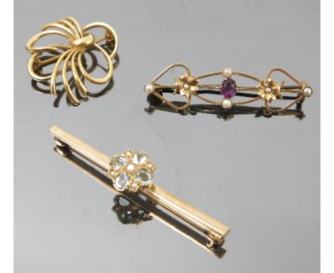 An aquamarine and split pearl 9ct gold bar brooch, together with an Edwardian brooch, tagged '9ct', and an unmarked stylized 