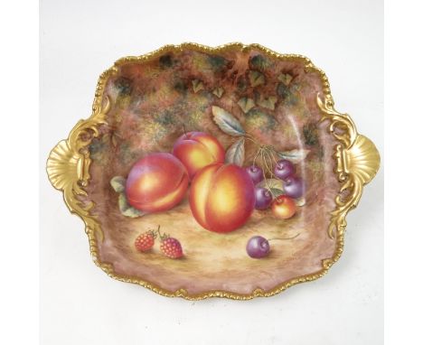 A Royal Worcester rectangular dish, decorated with hand painted fruit, by Ayrton, to a shaped gilded gadrooned edge, diameter