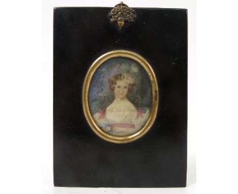 A 19th century oval portrait miniature, painted on ivory of a young woman, in black papier mache frame, maximum diameter of m