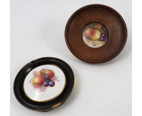 A Royal Worcester pot lid, hand painted with fruit, diameter 2.5ins, in a turned wooden frame, together with another framed p