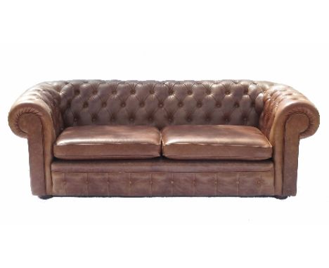 A leather Chesterfield, with deep button back and roll end arms, width 77ins 