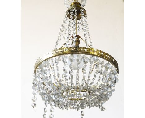A modern light fitting, with faceted glass droppers of various sizes, to a brass ring with further droppers below, height 17i