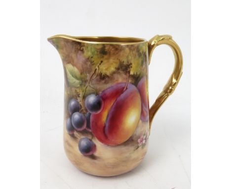 A Royal Worcester milk jug, decorated all around with hand painted fruit, by J Smith, to a gilded interior, height 4ins 