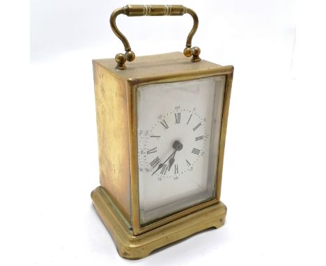 Brass anniversary clock with ceramic dial 15cm high- Missing it's back and crack to dial 