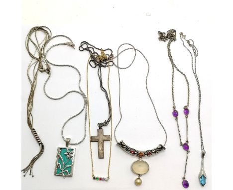 7 silver marked necklaces some with pendants incl. amethyst cabochon 44cm long, cross, stone panel set with flower detail etc