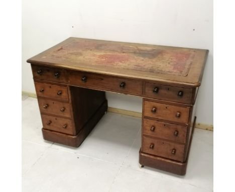 Antique mahogany pedestal desk with china castors and red leather insert to top 107cm long x 67cm deep x 72cm high. has losse