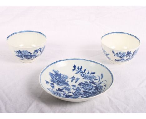 A pair of 18th Century Worcester porcelain fence pattern tea bowls and a saucer