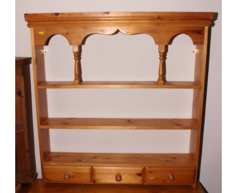 A pine open wall shelf, fitted three drawers, 37" wide