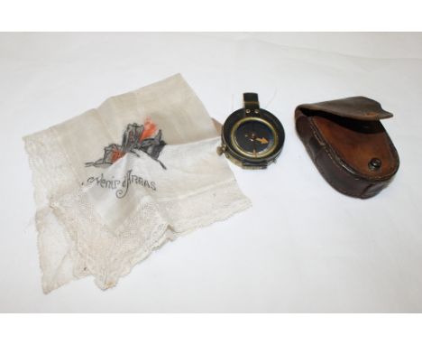 A WWI brass prismatic compass by Cruchon & Emons in leather belt pouch, a leaded glass panel decorated Dutch flag and dated 1