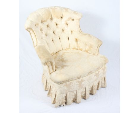 A Victorian tub armchair, button upholstered in a gold damask