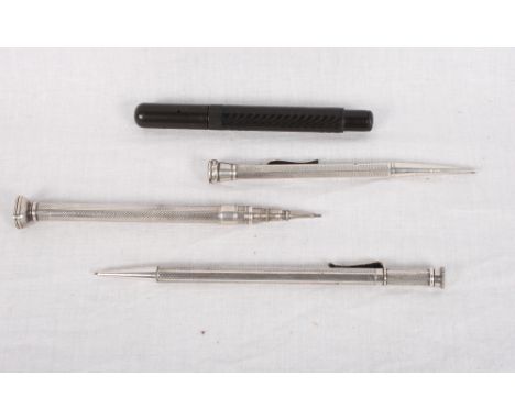 Three silver propelling pencils with engine turned decoration and a Mabie Todd & Co "Cygnet" propelling pencil