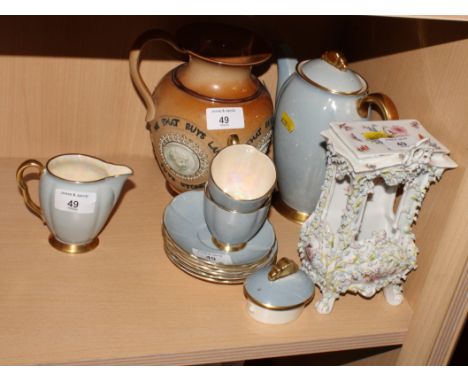 A Royal Doulton commemorative jug (chip to rim), a Carlton ware grey and gilt part coffee set and a late Victorian German flo