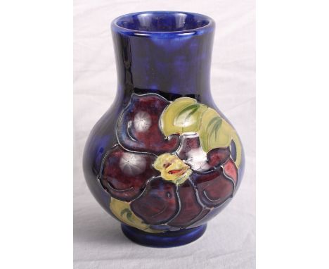 A Moorcroft bulbous vase with clematis decoration, 4" high