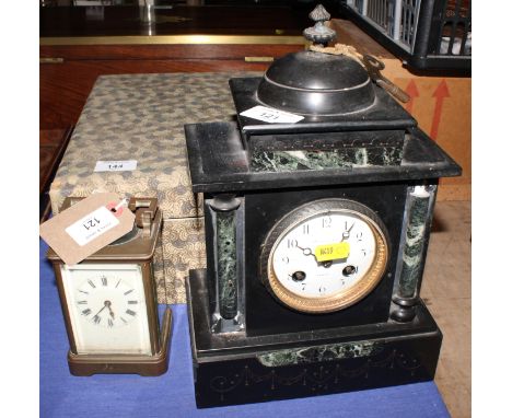 A brass cased carriage clock and a Victorian mantel clock in black slate case with cupola, 12" high