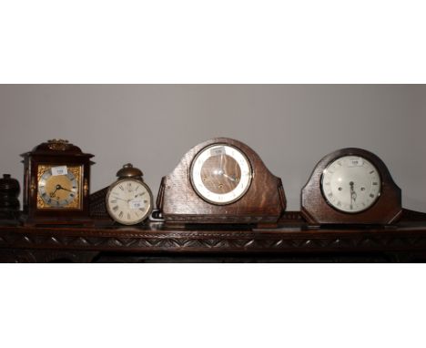 Two mid 20th Century oak cased mantel clocks, a Georgian design bracket clock and an Ansonia repeater alarm clock in drum cas