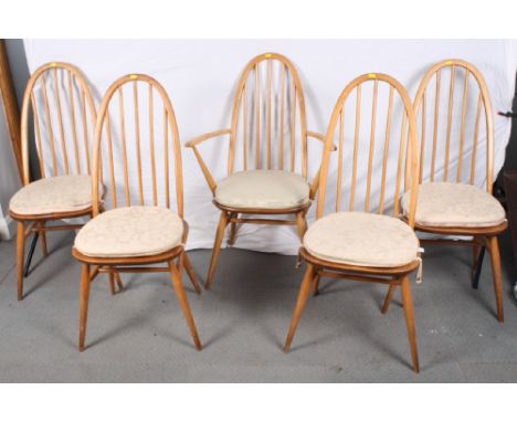 A set of five Ercol hoop and spindle back dining chairs (4+1) and a similar drop leaf Sutherland dining table, 50" wide