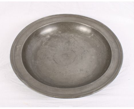 An 18th Century pewter bowl, border stamped crowned R M I, James Hitchman London 1701-1736, 14 1/2" dia