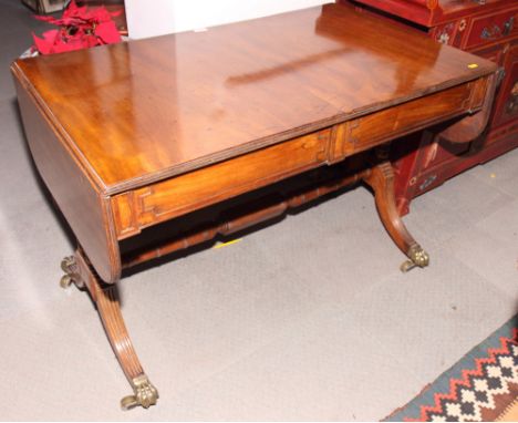 An early 19th Century mahogany sofa table, fitted frieze drawers with panelled fronts, on twin turned end supports, 42" x 26"