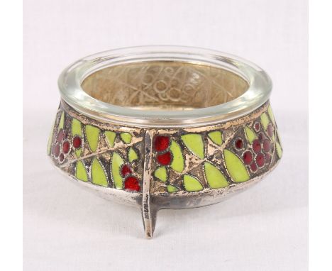 A white metal salt fitted glass liner, sides decorated in red and green enamel
