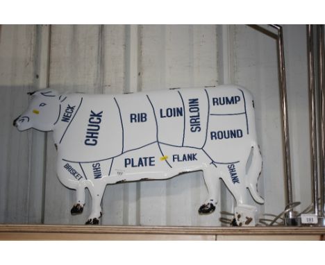 An enamel cow sign