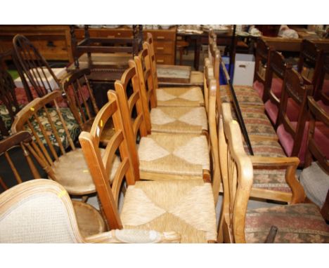 A set of four modern pine rush seated kitchen ladder back dining chairs 