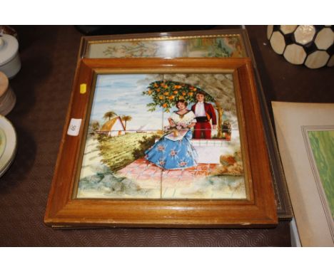 A needlework embroidery of a hunting scene and a framed Spanish tile picture