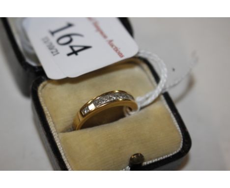 An 18ct gold ring (marks rubbed), size K, set with diamonds, 2.8 grams total weight