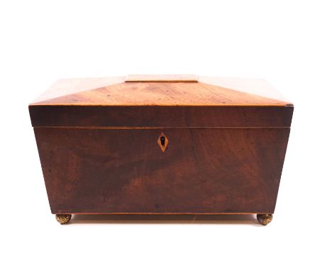A George III mahogany tea caddy, circa 1820, of sarcophagus form with original floral design, brass handles and feet, box woo