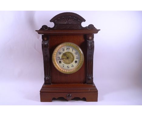An Edwardian  mahogany mantel clock, the movement striking on a gong by The United Clock Co Ltd, Birmingham, 41cm high