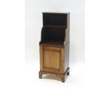 A pair of mahogany cupboards with shelves above, on bracket feet, 105cm high x 40cm wide x 31cm deep