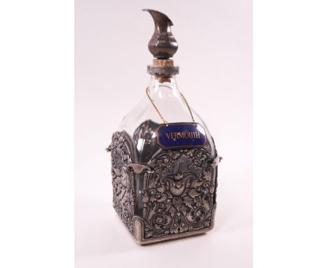 A Continental glass and pierced silver mounted decanter, stamped 800, 25cm high, with an enamel Vermouth label