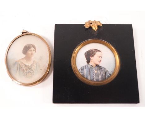 A Victorian portrait miniature of a lady wearing a striped dress and locket, watercolour on ivory, 5cm, and an Edwardian mini