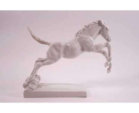 A 1950's Rosenthal porcelain figure of a jumping colt, printed factory mark in green, 15.5cm high