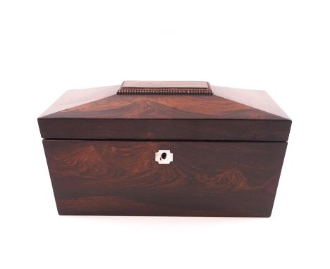 A 19th century rosewood tea caddy of sarcophagus shape and with ring handles, two lidded compartments within, 32cm wide
