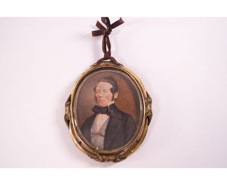 A Victorian portrait miniature of a Gentleman, watercolour, within a gilt metal frame, 5.5cm high