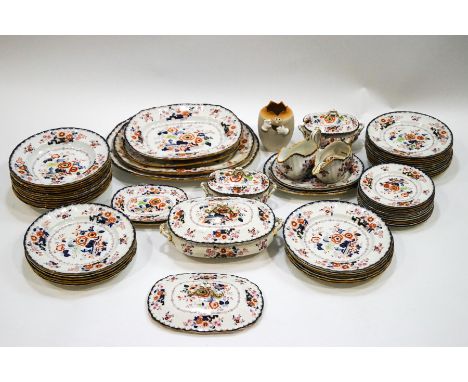A 19th century Masons ironstone dinner service, decorated with flowers and some Oriental motifs, comprising: twelve dinner pl