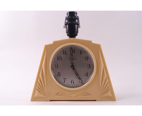A 1930s Ingersoll cream bakelite lamp/clock, 22cm high