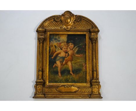 20th century, Two cherubs within a garden, oil on panel, 24cm x 18cm, in an ornate architectural gold painted frame