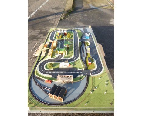 An 8' x 4' Tri-ang Minic 00 Gauge Railways layout built to a very good standard for promotional events, including black doubl