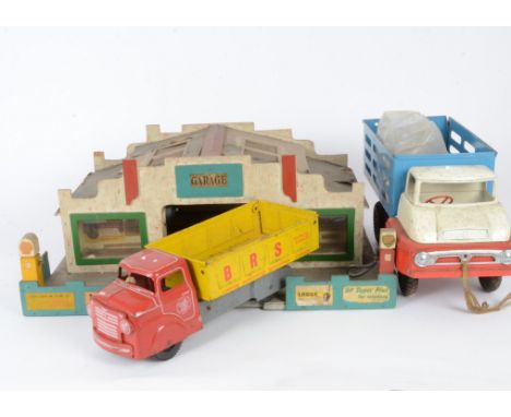 Tri-ang Steel Farm Truck Mettoy Truck and wooden Garage, Tri-ang Farm Truck with six pigs, Mettoy BRS Tipper Truck and a Tri-