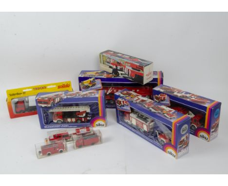 Modern Diecast and Plastic Fire Engines and Related Vehicles,  a boxed/packaged group comprising diecast models including Sik