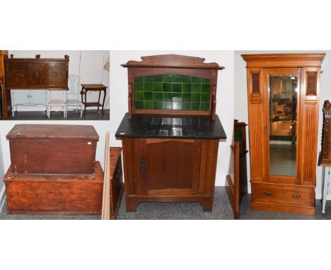 A group of furniture comprising two stained pine blanket chests; an Edwardian oak slate-topped marble-backed washstand; a mir