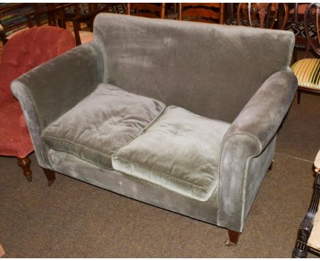 A Victorian two-seater sofa, drop end mahogany frame to castors, 140cm by 80cm by 89cm high .  Back legs both with a spliced 